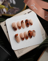 Pumpkin Patch almond press-on nails with warm brown tortoise nail art for fall