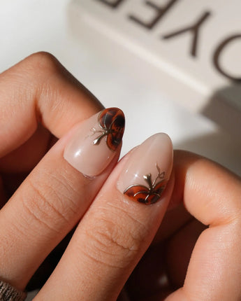 Pumpkin Patch reusable fall press-on nails in orange brown tortoise shell design