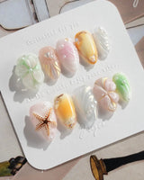Fairy Bay press-ons with soft dreamy sea tones, flowers, butterflies, and starfish