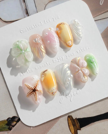 Fairy Bay press-ons with soft dreamy sea tones, flowers, butterflies, and starfish