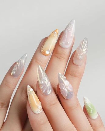 Fairy Bay handmade ocean nails with soft florals, butterfly details, and starfish accents