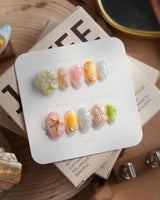 Fairy Bay extra short oval nails with butterfly, starfish, and floral ocean design
