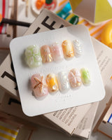 Fairy Bay short square press-on nails with pastel 3D starfish and butterfly accents