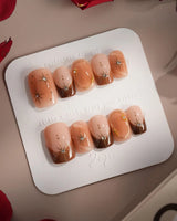 Fall Makeup press-ons with caramel brown tones, gold star accents, and crystal details