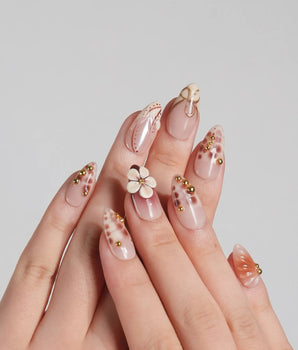 Caramel Cream press-on nails with warm brown base, sculpted flowers, and gold wire details