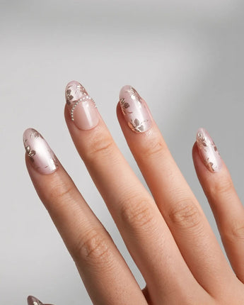 Close-up of Falling Sakura-Gold nails with light-shifting pink shimmer and gold petal art
