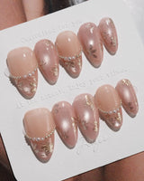 Falling Sakura-Gold press-ons with glowing champagne pink gel and gold floral details