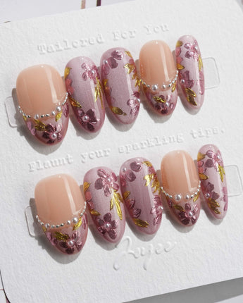 Falling Sakura press-on nails in medium oval shape — Elegant Rosy Mauve, Hand-painted Blooms & Pearls.