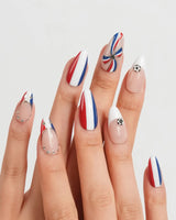 FIFA France medium almond nails with navy white red rosette and gold star accents