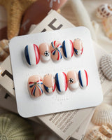 FIFA France short oval nails with chic tricolor soccer theme and 3D accents