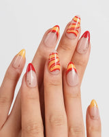 FIFA Spain game day press-ons with hand-painted flag colors and soccer ball nail charms