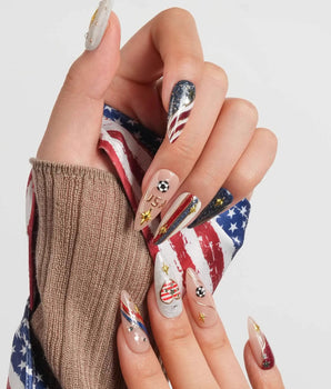 FIFA USA handmade nails with stars and stripes, gold USA lettering, and soccer ball charms