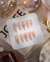 First Flake nail art close-up showing Icy Milky White & Radiant Silver, 3D Snowflake Art & Shimmering Star Accents. details