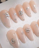 First Flake handmade press-on nails featuring Icy Milky White & Radiant Silver, 3D Snowflake Art & Shimmering Star Accents.