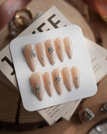 First Flake nails in medium stiletto — Icy Milky White &
