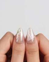 First Vow press-on nails in short almond shape — Gentle Milk Tea Nude, Hand-painted White Florals & Pearl Accents.