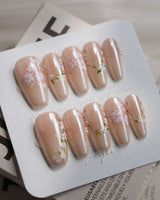 First Vow press-on nails — Gentle Milk Tea Nude, Hand-painted White Florals & Pearl Accents. handmade nail art by Joyee Nails