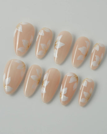 Fleur Fantasy press-on nails in medium almond shape — white floral french tip nails