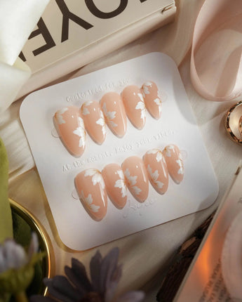 Fleur Fantasy handmade press-on nails featuring white floral french tip nails