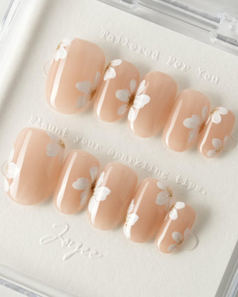 Fleur Fantasy press-on nails in short oval shape — white floral french tip nails