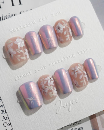 Flower Sea press-on nails in extra short coffin shape —  Lavender chrome and Hand-painted White Florals