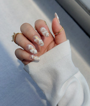 Fluffy Puffs handmade press-on nails featuring nude chrome cloud nails