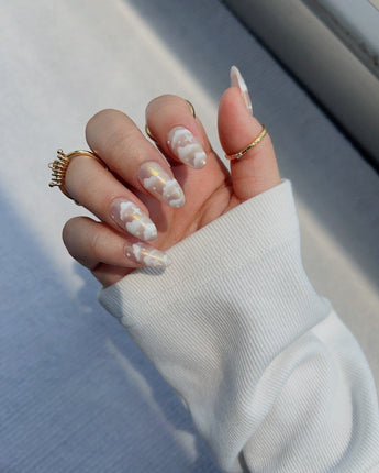 Fluffy Puffs handmade press-on nails featuring nude chrome cloud nails