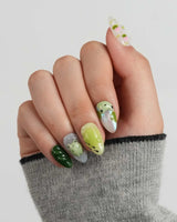 Frog Dodo custom press-on nails with tiny pond scene and glossy green gel finish