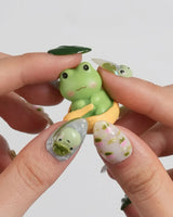 Frog Dodo fresh green press-on nails with floating leaves and lotus flower accents