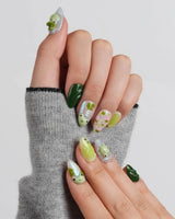Frog Dodo extra short almond nails with soft green gradient and delicate pink flowers