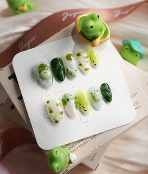 Frog Dodo handmade press-on nails featuring frog nail art
