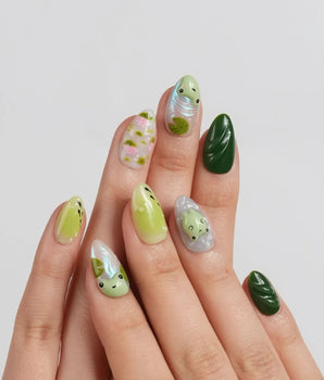 Frog Dodo close-up of frog nail art with pink lotus flowers and floating leaves