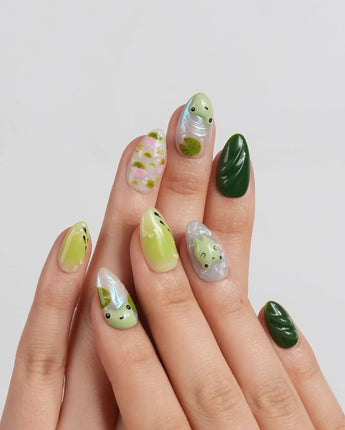 Frog Dodo close-up of frog nail art with pink lotus flowers and floating leaves