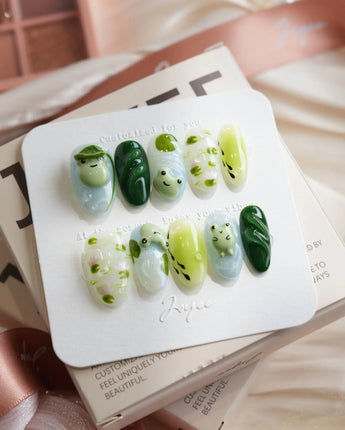Frog Dodo pond press-on nails in medium oval shape