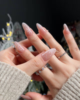 Frost Petals nail art close-up showing Sheer Nude Pink, Delicate White Snowflakes. details