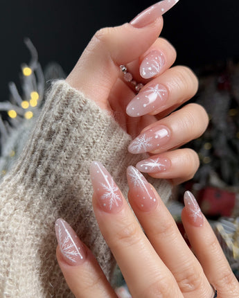 Frost Petals press-on nails — Sheer Nude Pink, Delicate White Snowflakes. handmade nail art by Joyee Nails