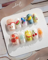 Fruit Picnic press-on nails with juicy fruit details and light pastel color blocking