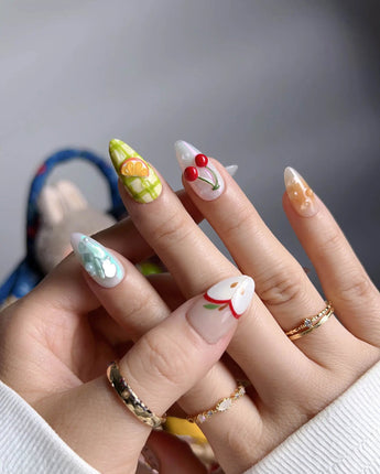 Fruit Picnic close-up of 3D fruit nail art on a colorful pastel layout