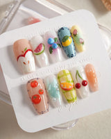 Fruit Picnic playful fruit nails with pastel gel polish and glossy 3D accents
