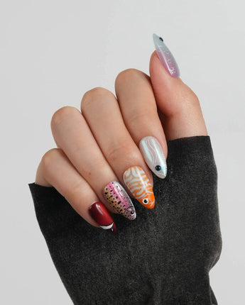 Funky Fish short almond press-on nails with bold coral reef fish characters