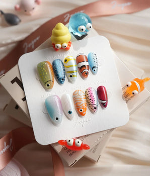 Funky Fish handmade fish nail art with clownfish stripes and bright skittle colors
