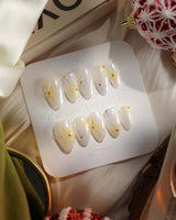 Garden Party press-on nails in extra short almond shape — minimal floral french tip