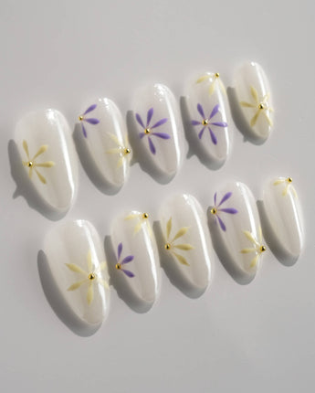 Garden Party press-on nails in short almond shape — minimal floral french tip