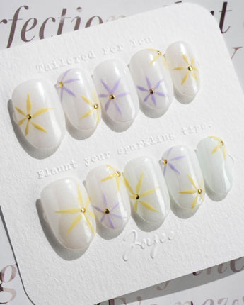 Garden Party press-on nails in short oval shape — minimal floral french tip
