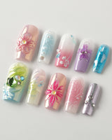 Gem Blossom press-on nails in medium square shape — pastel mix design chrome iridescent flower pearl butterfly 3D accents