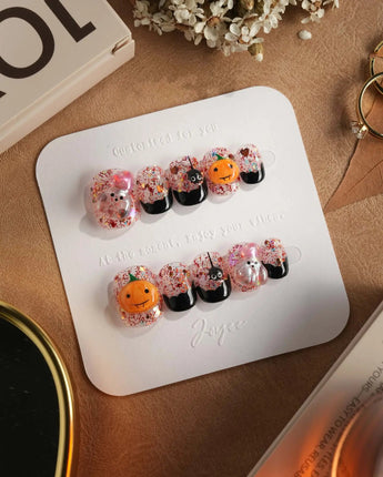 Ghost Kiki press-on nails in extra short squoval shape — Orange & Black Halloween, 3D Pumpkin & Ghost Glitters.