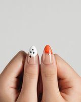 Ghostlight press-on nails in short almond shape — Playful Halloween, Pumpkin & Ghost Glitters.