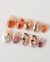 Ghostlight press-on nails in extra short almond shape — Playful Halloween, Pumpkin & Ghost Glitters.