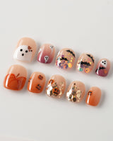 Ghostlight press-on nails in extra short squoval shape — Playful Halloween, Pumpkin & Ghost Glitters.