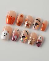 Ghostlight press-on nails in short coffin shape — Playful Halloween, Pumpkin & Ghost Glitters.